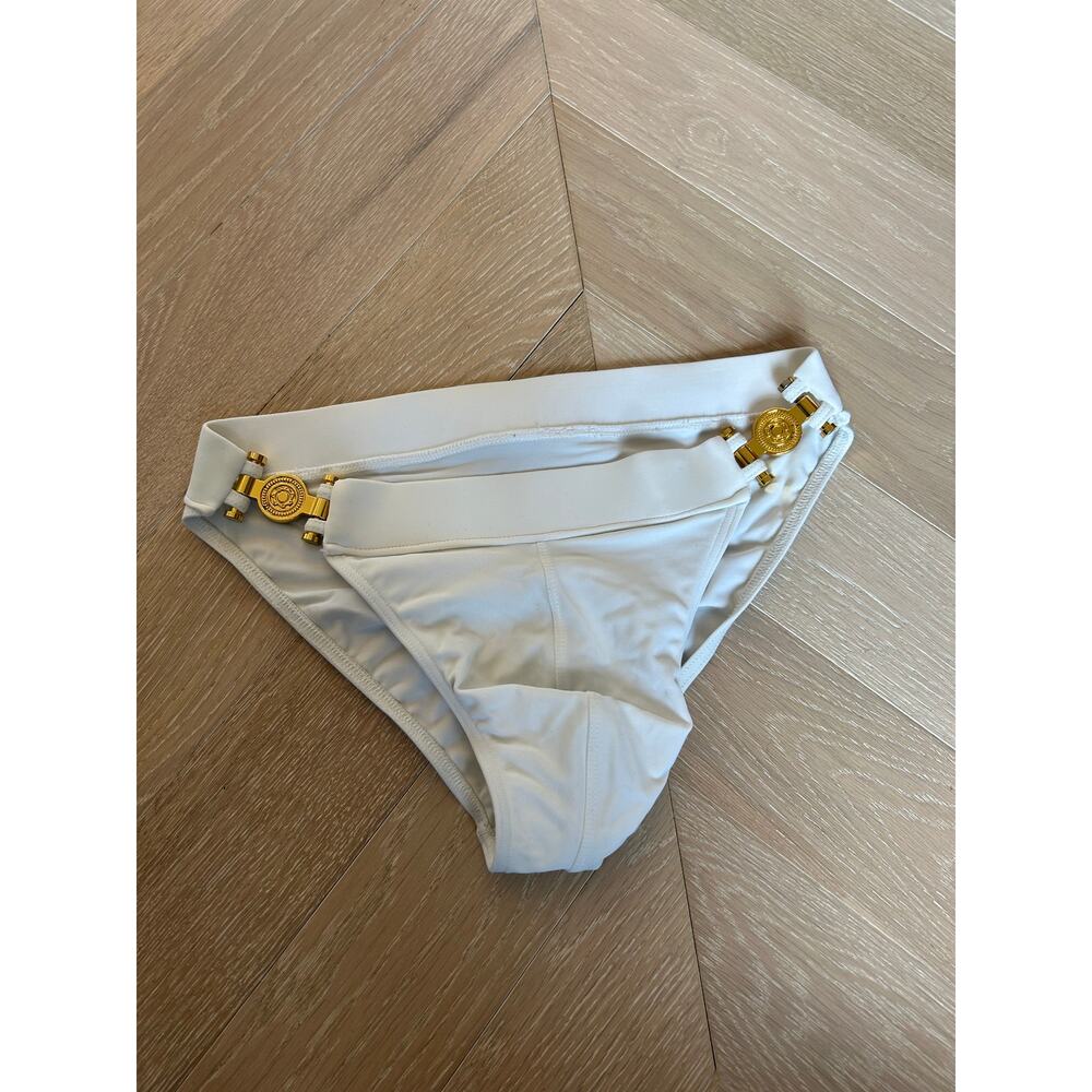Charlie Greco Brief swimwear, men’s size small, white with gold hardware.